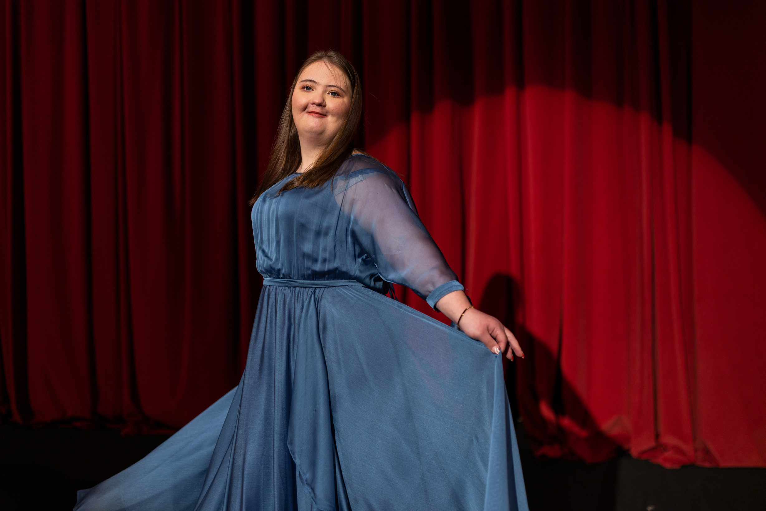 Young woman with down syndrome dancing on stage